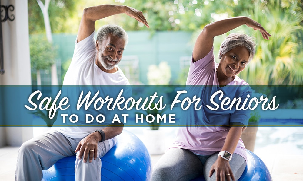 Senior couple exercising together at home