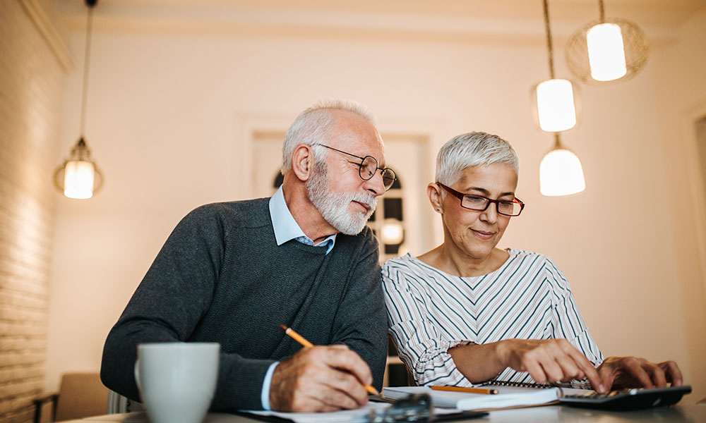  Couple budgeting for large expenses during retirement