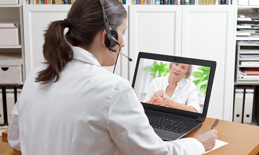 Woman talking to her doctor online